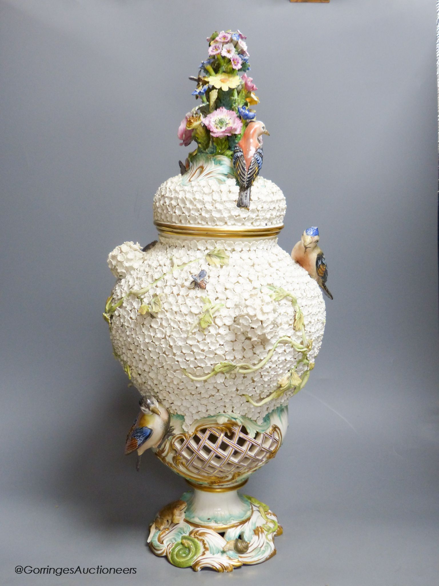 A large 19th century Continental porcelain floral encrusted vase and cover, height 58cm